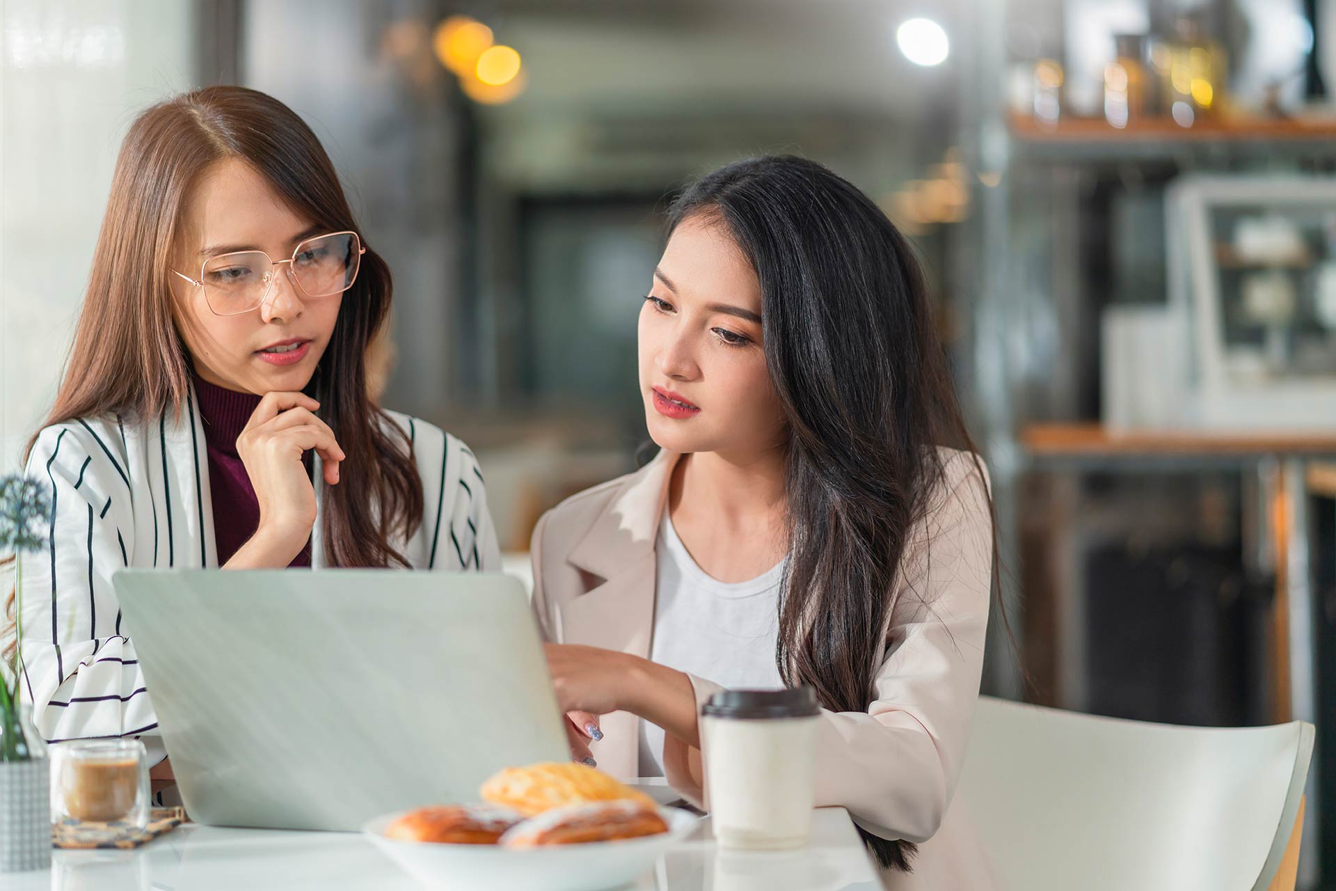SEO consultants in Malaysia reviewing website ranking results with a client